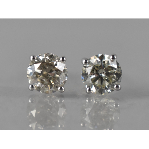 67 - A Pair of 18ct White Gold and Diamond Solitaire Studs, Round Brilliant Cut Diamonds with Total Weigh... 