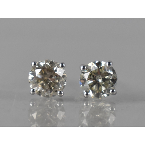 67 - A Pair of 18ct White Gold and Diamond Solitaire Studs, Round Brilliant Cut Diamonds with Total Weigh... 