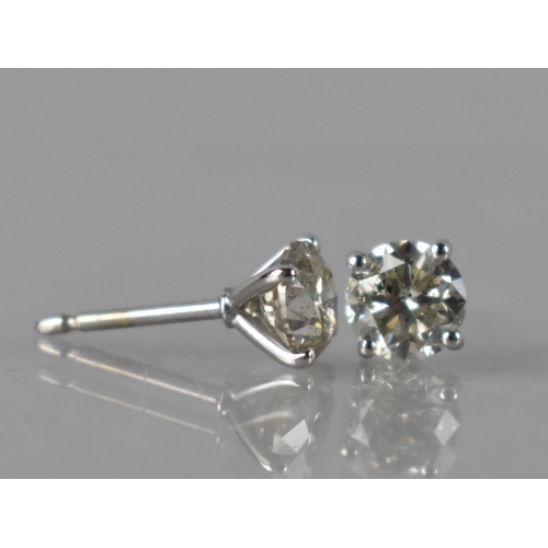 67 - A Pair of 18ct White Gold and Diamond Solitaire Studs, Round Brilliant Cut Diamonds with Total Weigh... 