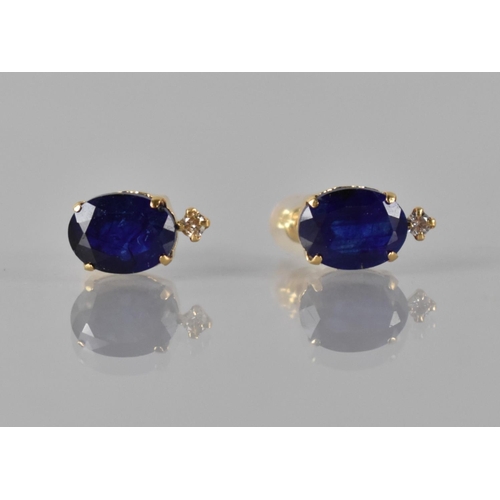 68 - A Pair of 18ct Yellow Gold, Sapphire and Diamond Mounted Stud Earrings, Oval Cut Sapphires Measuring... 