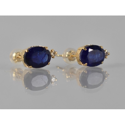 68 - A Pair of 18ct Yellow Gold, Sapphire and Diamond Mounted Stud Earrings, Oval Cut Sapphires Measuring... 