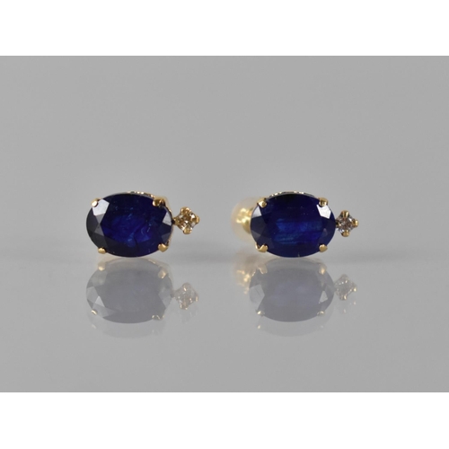 68 - A Pair of 18ct Yellow Gold, Sapphire and Diamond Mounted Stud Earrings, Oval Cut Sapphires Measuring... 