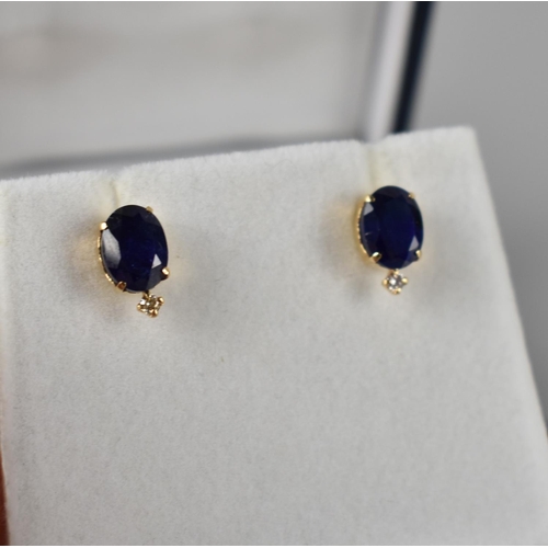 68 - A Pair of 18ct Yellow Gold, Sapphire and Diamond Mounted Stud Earrings, Oval Cut Sapphires Measuring... 