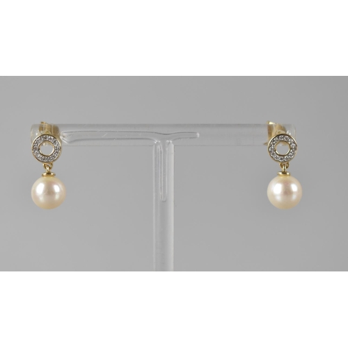 75 - A Pair of 9ct Gold, Diamond and Pearl Earrings, Pearl Drops Approx 8mm Diameter, Surmounted by Diamo... 