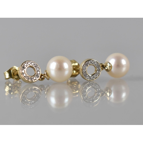 75 - A Pair of 9ct Gold, Diamond and Pearl Earrings, Pearl Drops Approx 8mm Diameter, Surmounted by Diamo... 