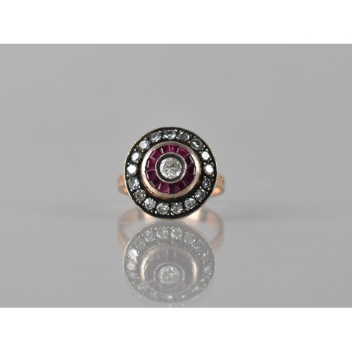 80 - A Middle Eastern Diamond and Ruby Ring, Central Round Cut Diamond Bezel Set Measuring 4mm Diameter, ... 