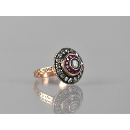 80 - A Middle Eastern Diamond and Ruby Ring, Central Round Cut Diamond Bezel Set Measuring 4mm Diameter, ... 