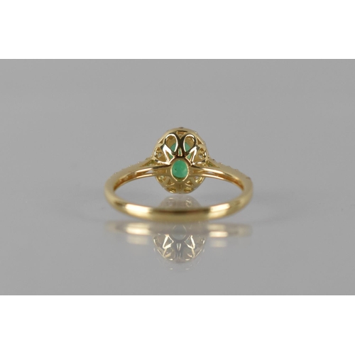 83 - A 14ct Yellow Gold, Emerald and Diamond Dress Ring, Central Oval Emerald Measuring 7x5mm Approx, (0.... 