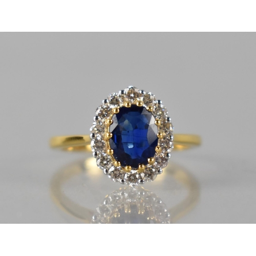 85 - An 18ct Gold, Kyanite and Diamond Cluster Ring, Central Raised Claw Set Oval Cut Stone Measuring 1.6... 