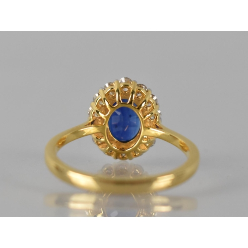 85 - An 18ct Gold, Kyanite and Diamond Cluster Ring, Central Raised Claw Set Oval Cut Stone Measuring 1.6... 