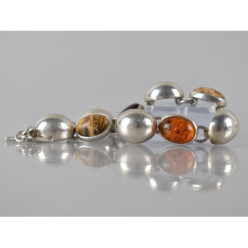 176 - A Mexican Silver Eight Panel Bracelet Comprising Large Cabochon Jasper, Amber and Tigers Eye Stones ... 