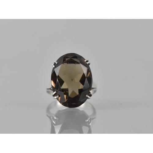 180 - A Silver and Smokey Quartz Cocktail Ring, Central Oval Cut Stone Measuring 20mm by 13mm and Raised o... 