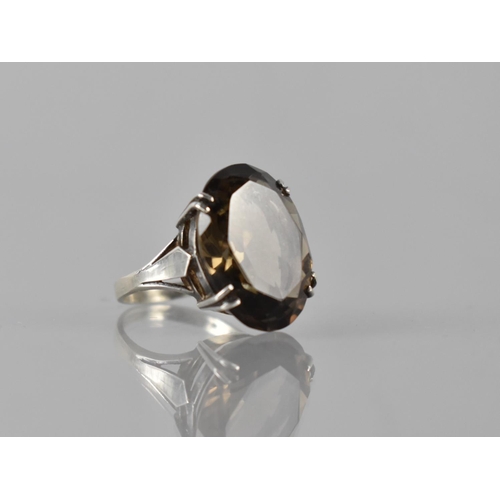 180 - A Silver and Smokey Quartz Cocktail Ring, Central Oval Cut Stone Measuring 20mm by 13mm and Raised o... 