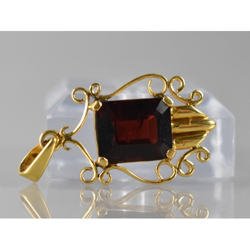 98 - A 14ct Gold and Garnet Pendant, Emerald Cut Stone Measuring 11x9.5mm in Four Claw Setting, Shield Sh... 