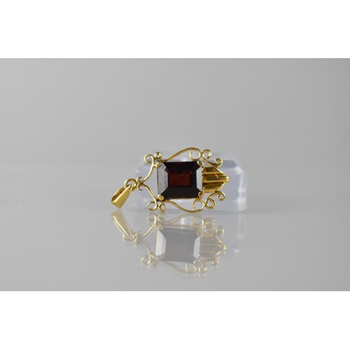 98 - A 14ct Gold and Garnet Pendant, Emerald Cut Stone Measuring 11x9.5mm in Four Claw Setting, Shield Sh... 