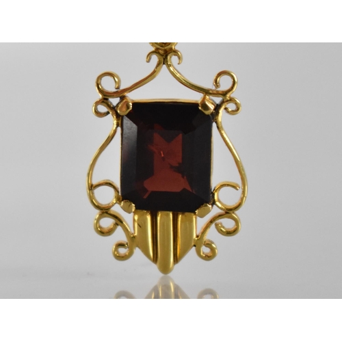 98 - A 14ct Gold and Garnet Pendant, Emerald Cut Stone Measuring 11x9.5mm in Four Claw Setting, Shield Sh... 