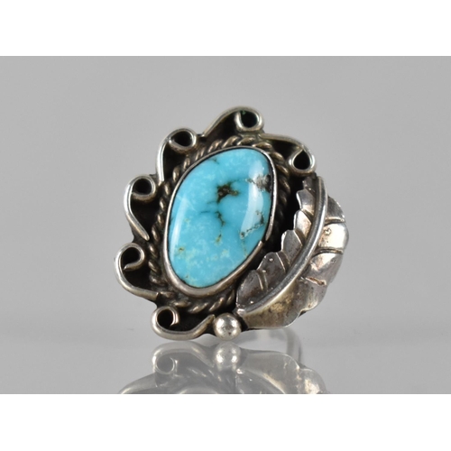 150 - A Large Turquoise Mounted Navajo Ring in Unmarked White Metal, Irregular Turquoise Cabochon Measurin... 