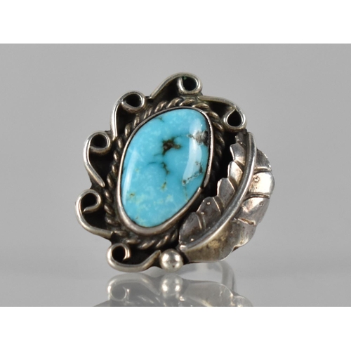 150 - A Large Turquoise Mounted Navajo Ring in Unmarked White Metal, Irregular Turquoise Cabochon Measurin... 