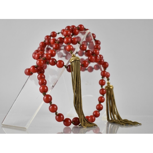 216 - An Early 20th Century Long String of Cherry Coloured Spherical Beads Each Approx 10mm Diameter, Stru... 