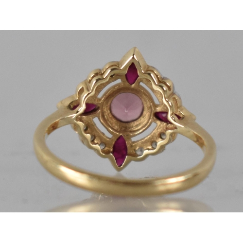 18 - A Diamond, Pink Tourmaline and Ruby Ring by Luke Stockley in 9ct Gold, Central Round Cut Tourmaline,... 