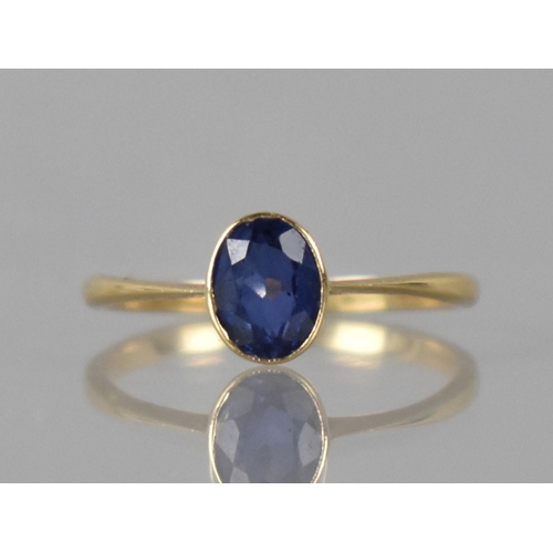 19 - A Late 19th/Early 20th Century Sapphire and 18ct Gold Solitaire Ring, Oval Cut Sapphire Measuring 6m... 