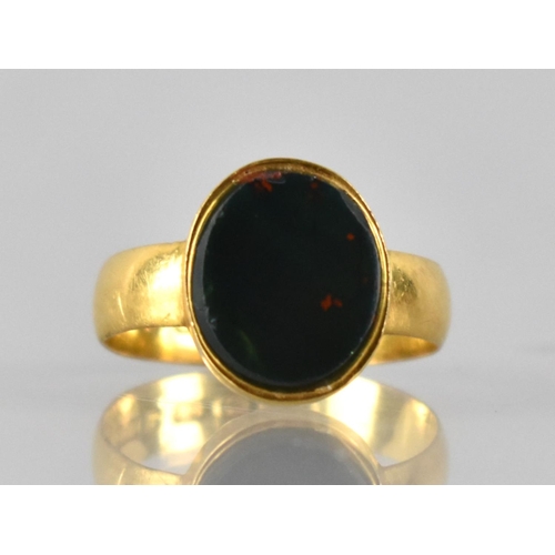 22 - A Victorian 22ct Gold and Bloodstone Ring, Oval Bloodstone Panel Measuring 12mm by 10mm Collet Set t... 