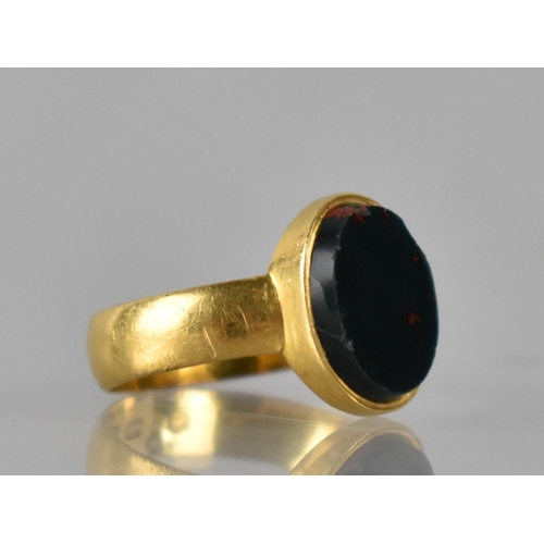 22 - A Victorian 22ct Gold and Bloodstone Ring, Oval Bloodstone Panel Measuring 12mm by 10mm Collet Set t... 