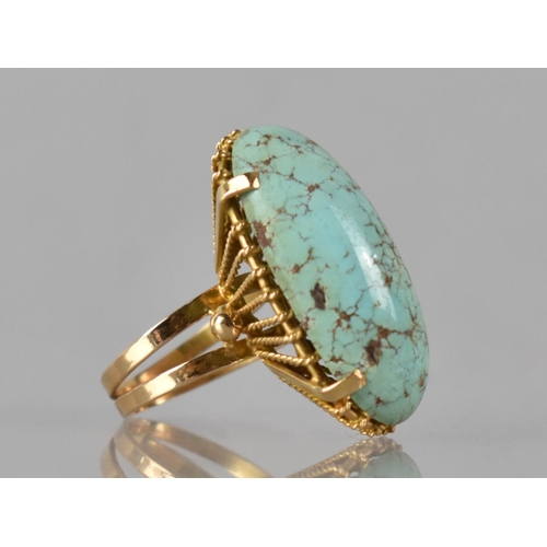 24 - An Egyptian 18ct Gold and Turquoise Ring, Large Elongated Oval Cabochon Turquoise Measuring 29mm by ... 
