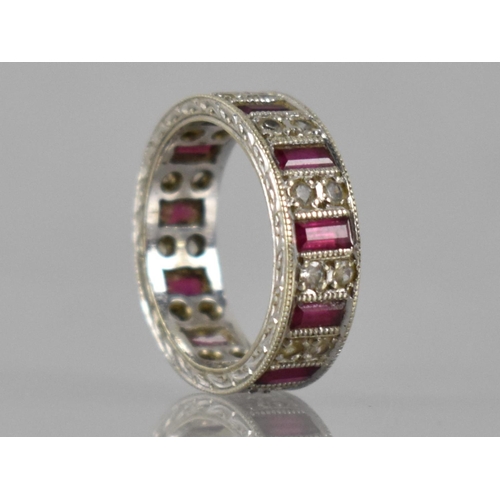 25 - An Elizabeth II 9ct White Gold, Ruby and White Sapphire Eternity Ring, Eleven Baguette Cut Rubies Me... 