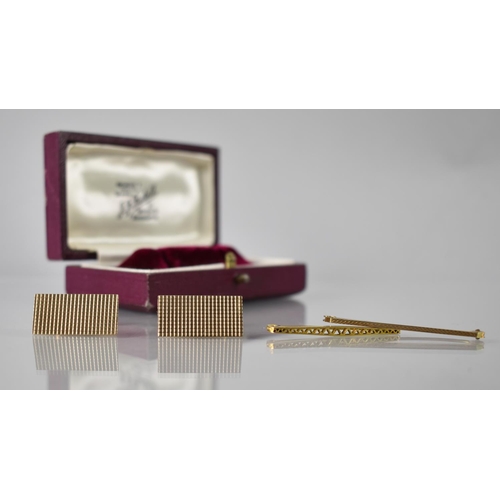 101 - A Cased Pair of 9ct Gold Cufflinks of Elongated Rectangular Form with Engraved Square Textured Decor... 