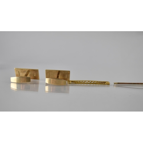 101 - A Cased Pair of 9ct Gold Cufflinks of Elongated Rectangular Form with Engraved Square Textured Decor... 