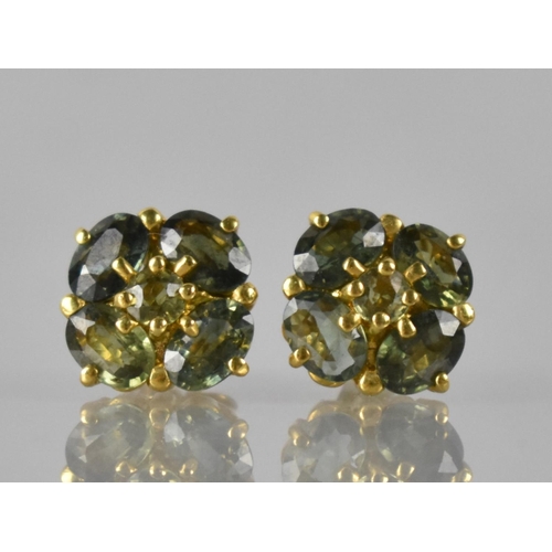 36 - A Pair of Green Stone Cluster Earrings (Testing as Sapphires), Central Round Cut Stone 3mm Diameter ... 