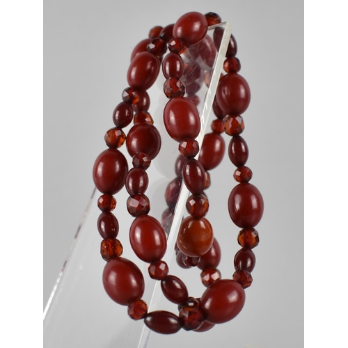 218 - A Vintage Cherry Bakelite Bead Necklace, Mixed Size Beads, Faceted and Ovoid, Largest 16mm Wide, 45.... 