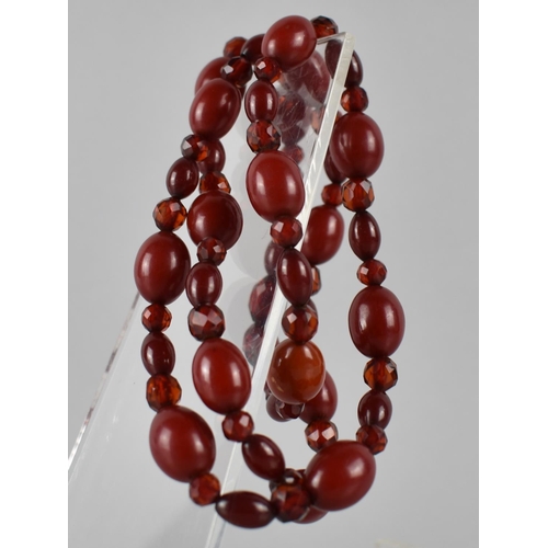 218 - A Vintage Cherry Bakelite Bead Necklace, Mixed Size Beads, Faceted and Ovoid, Largest 16mm Wide, 45.... 