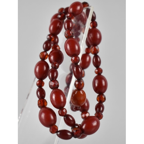 218 - A Vintage Cherry Bakelite Bead Necklace, Mixed Size Beads, Faceted and Ovoid, Largest 16mm Wide, 45.... 