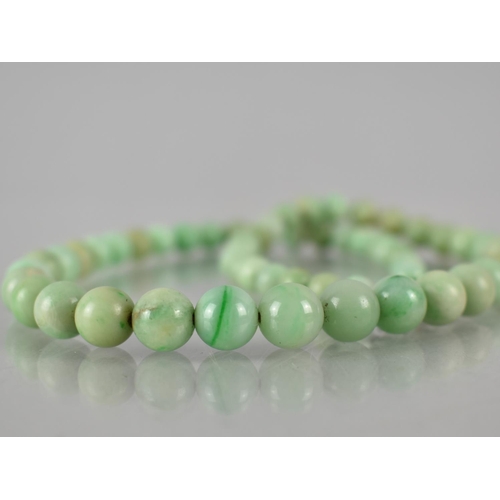 220 - A String of Graduated Jade Beads, Largest Spherical Bead Measuring 9.5mm Diameter, Varying Shades on... 