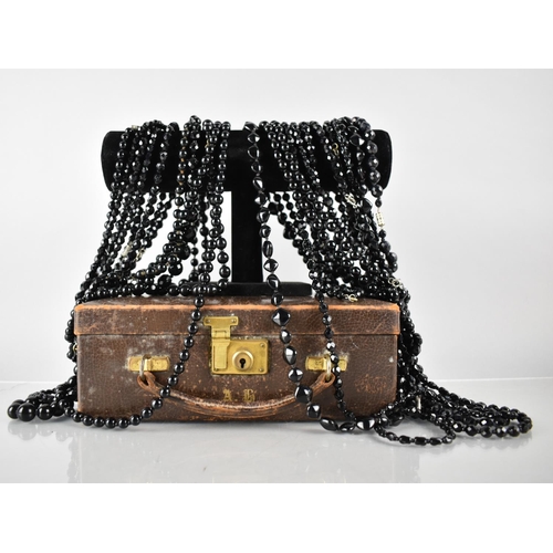 223 - A Vintage Leather Covered Jewellery Box Containing a Quantity of Black Glass Bead Necklaces to inclu... 