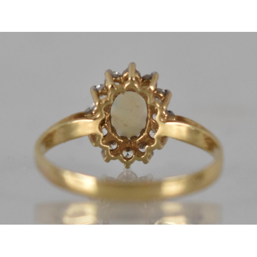 40 - A 9ct Gold, Opal and CZ Ladies Dress Ring, Prong Set Central Oval Cabochon Plaque 6mm by 4mm with a ... 