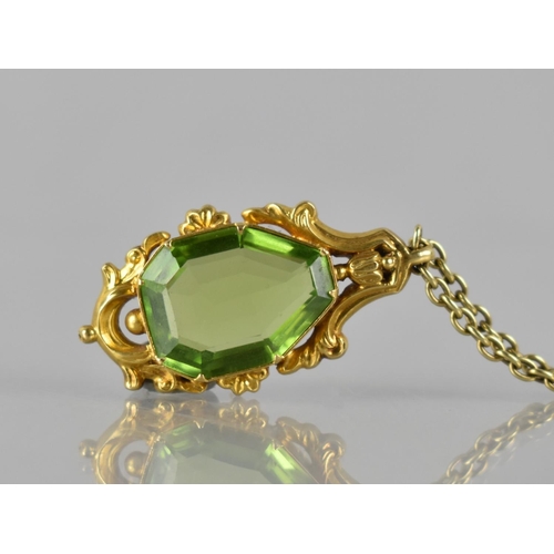 43 - A 19th Century Gold Metal Mounted Freeform, Step Cut Peridot Pendant, Stone Measuring 16mm by 12mm M... 