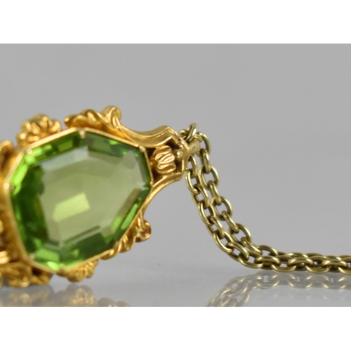 43 - A 19th Century Gold Metal Mounted Freeform, Step Cut Peridot Pendant, Stone Measuring 16mm by 12mm M... 