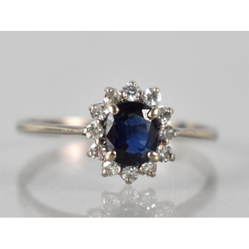50 - A 14ct White Gold, Sapphire and Diamond Ring, Oval Cut Sapphire Measuring 5mm by 4mm Mounted in Four... 