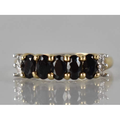 51 - A 9ct Gold, Garnet and Diamond Ring to Comprise Five Oval Cut Stones (4.5mm by 3mm Approx), Claw Set... 