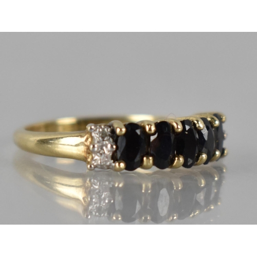 51 - A 9ct Gold, Garnet and Diamond Ring to Comprise Five Oval Cut Stones (4.5mm by 3mm Approx), Claw Set... 