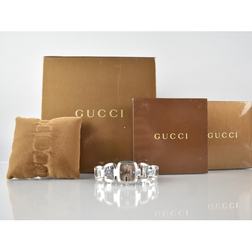 134 - A Ladies Gucci Wrist Watch, Diamond Mounted Silvered Dial in a G Shaped Stainless Steel Case Measuri... 