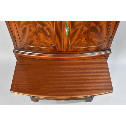 106 - A Modern Mahogany Bow Fronted Cocktail Cabinet, the Panelled Doors Opening to Shelved Mirrored Top S... 