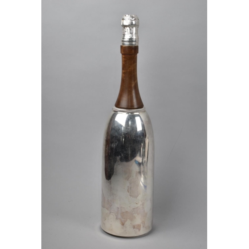 114 - A Novelty Cocktail Shaker in the Form of a Silver Plated Champagne Bottle, 37cm High