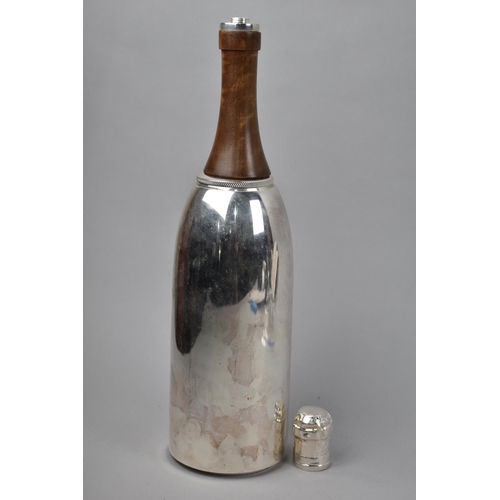 114 - A Novelty Cocktail Shaker in the Form of a Silver Plated Champagne Bottle, 37cm High