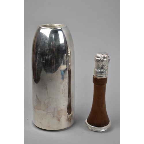 114 - A Novelty Cocktail Shaker in the Form of a Silver Plated Champagne Bottle, 37cm High