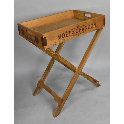 120 - A Reproduction Butlers Tray on Stand, The Sides Named with Various Brands of Champagne, 65x45cms