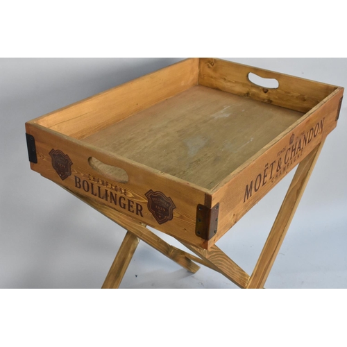 120 - A Reproduction Butlers Tray on Stand, The Sides Named with Various Brands of Champagne, 65x45cms